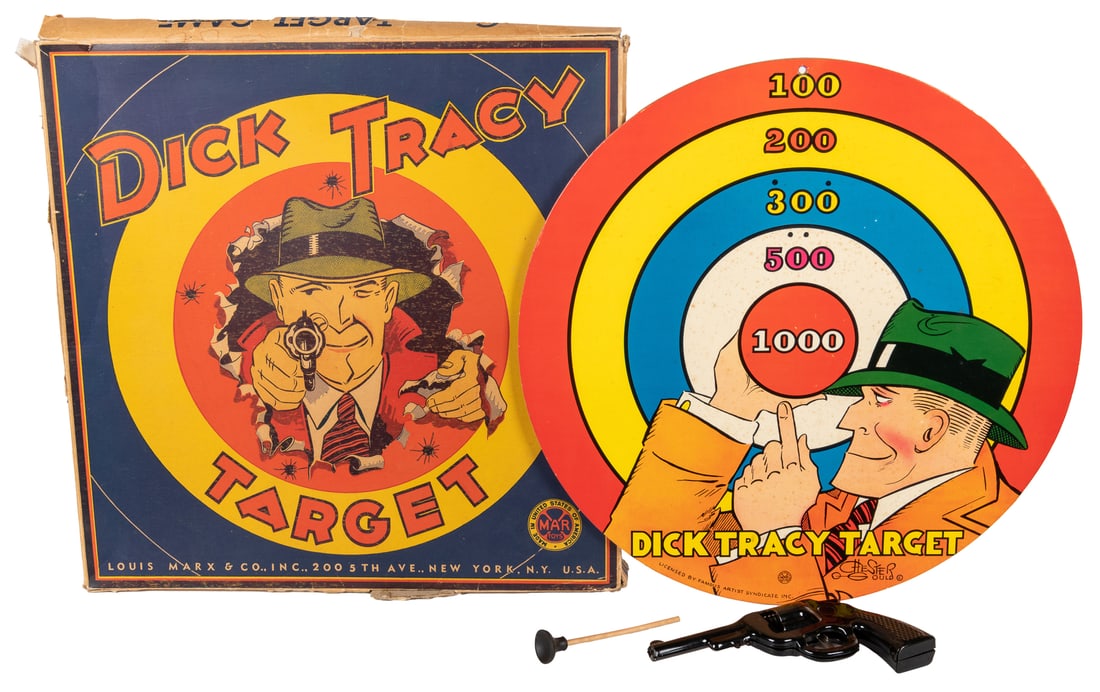 Dick Tracy Target Game in Original Box. New York: Louis Mar...: Dick Tracy Target Game in Original Box. New York: Louis Marx, ca. 1930s. Colorfully printed round target designed by Chester Gould, boxed, with dart-shooting gun, darts (2), and instructional envelope