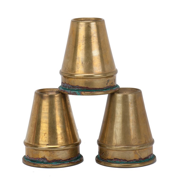 Cups and Balls. Early set of three spun brass cups: Cups and Balls. Early set of three spun brass cups in the traditional conical shape, used to perform the ancient conjuring feat. 3 ½” high, mouth 2 ¾” in diameter. Rims show significant tarnish.