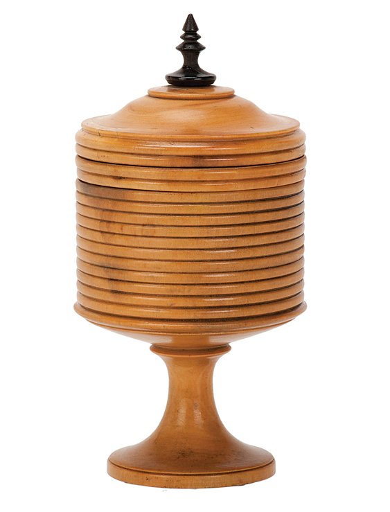Millet Vase. European, ca. 1880.: Millet Vase. European, ca. 1880. A quantity of dry seeds transform into another small object when placed in this vase. Turned boxwood. 3 ½” tall. One chip to rim of gimmick not affecting working; v