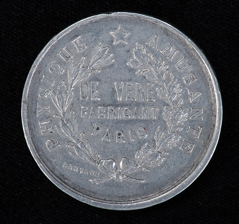 Charles De Vere magic shop token. Paris, ca. 1885: DeVere, Charles. De Vere magic shop token. Paris, ca. 1885. Palming coin advertising De Vere’s magic factory. MT106.