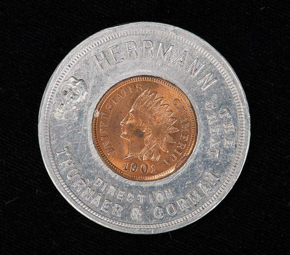 Herrmann the Great encased penny. 1901: Herrmann, Leon. Herrmann the Great encased penny. 1901 Indian Head cent encased in aluminum. The obverse bears a relief portrait of Herrmann and the text “Herrmann The Great Direction Thuraner & Gor