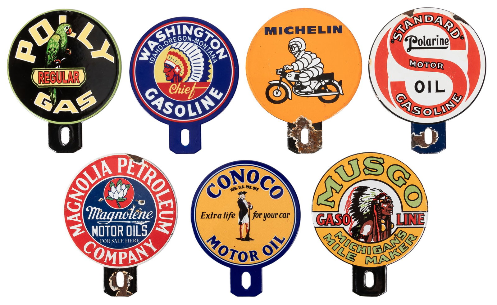 Group of 7 License Plate Toppers. Group of 7 paddle-shaped ...: Group of 7 License Plate Toppers. Group of 7 paddle-shaped single-sided porcelain (SSP) license plate toppers including: Magnolia Petroleum Company / Magnolene Motor Oils. – Michelin. – Ch