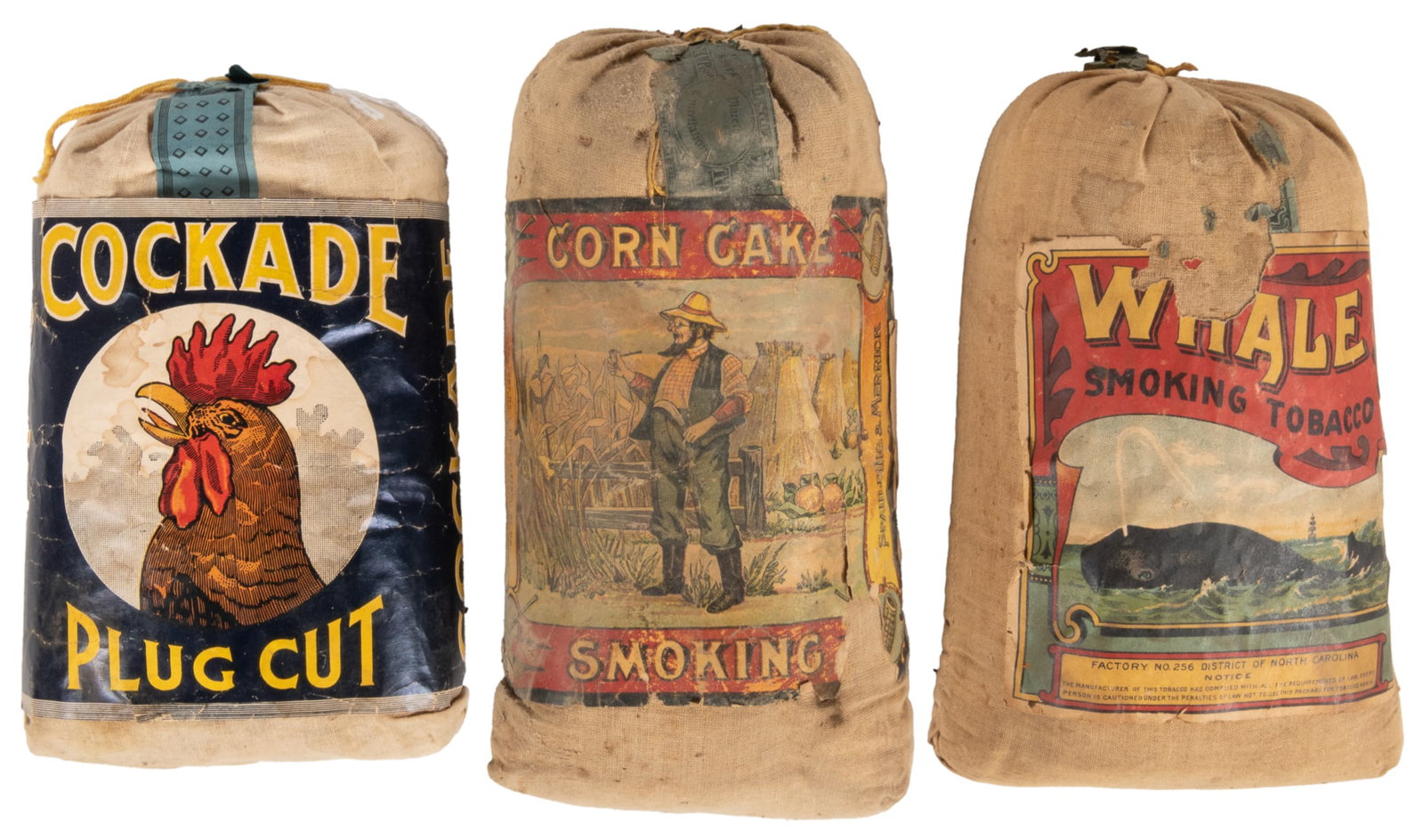 Three Tobacco Bags. Early 20th century. Group of three 12 o...: Three Tobacco Bags. Early 20th century. Group of three 12 oz. unopened tobacco sachets including Corn Cake Smoking. Spaulding & Merrick. – Whale Smoking Tobacco. District of North Carolina. R