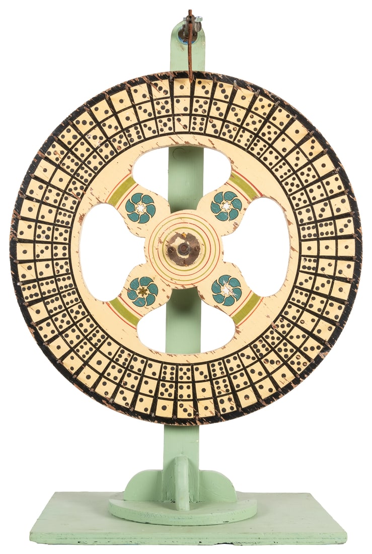 Dice Gaming Wheel on Stand. Circa 1930s-40s. Gambling wheel...: Dice Gaming Wheel on Stand. Circa 1930s-40s. Gambling wheel with stencil painted dice, on a light green wooden stand, leather clacker. Height 34”. Diam. 23 ½”.