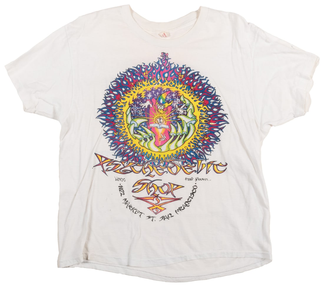 [GRATEFUL DEAD]. Psychedelic Shop Mikio / Phil Brown T-Shir...: [GRATEFUL DEAD]. Psychedelic Shop Mikio / Phil Brown T-Shirt. Hanes, 1980s. Size XL 100% cotton t-shirt for the Psychedelic Shop / 1072 Market St. San Francisco, with a wizard, mushroom, and sun graph