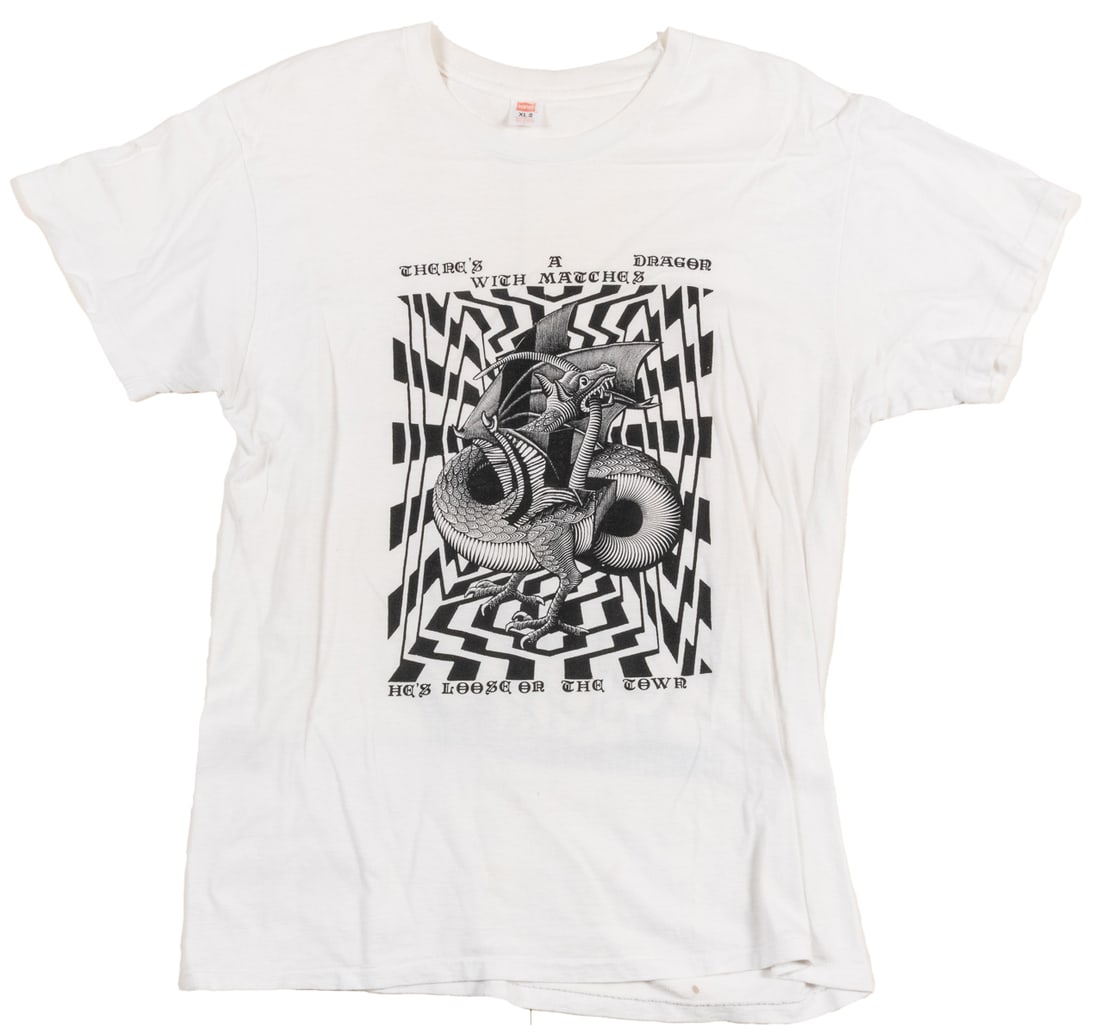 [GRATEFUL DEAD]. [ESCHER, M.C. (1898-1972)]. Fire on the Mo...: [GRATEFUL DEAD]. [ESCHER, M.C. (1898-1972)]. Fire on the Mountain / MC Escher Dragon T-Shirt. Hanes, 1980s. Size XL 100% cotton t-shirt with graphic of MC Escher’s Dragon and Grateful Dead lyric