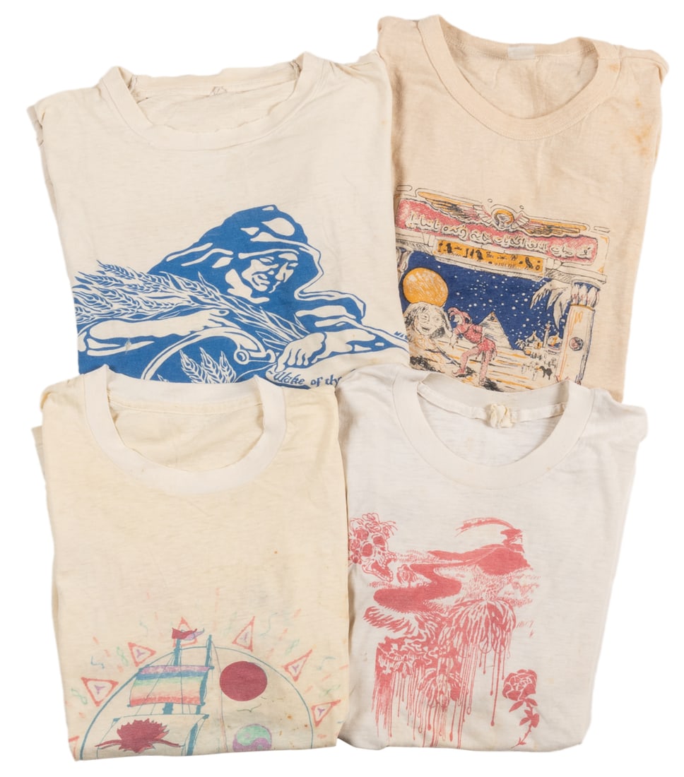 [GRATEFUL DEAD]. Group of Four “Dead Lot” T-Shirts. 1970s-8...: [GRATEFUL DEAD]. Group of Four “Dead Lot” T-Shirts. 1970s-80s. Group of 100% cotton original Grateful Dead “parking lot” shirts made by artisans, folk artists, and fans of the 
