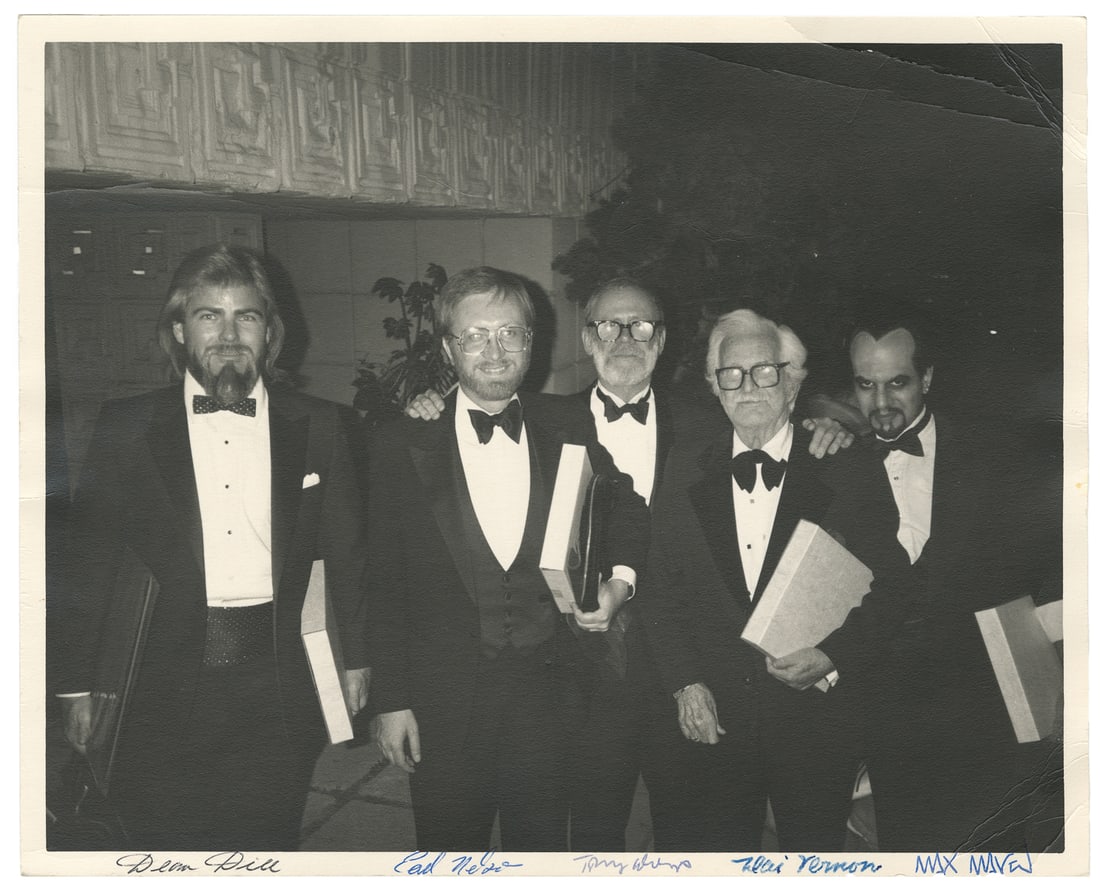 [MAVEN, Max (1950 – 2022]. Signed photograph of Maven with ...: [MAVEN, Max (1950 – 2022]. Signed photograph of Maven with Dai Vernon and other magicians. Matte-finish photograph of the five magicians at a black tie event probably at the Magic Castle, signed