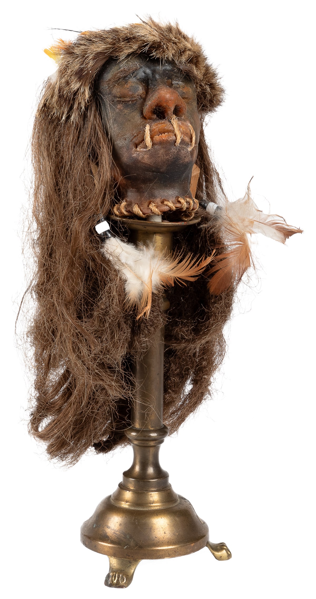 Gaff Shrunken Head. 20th century. Gaff shrunken head on bra... (1 of 3)