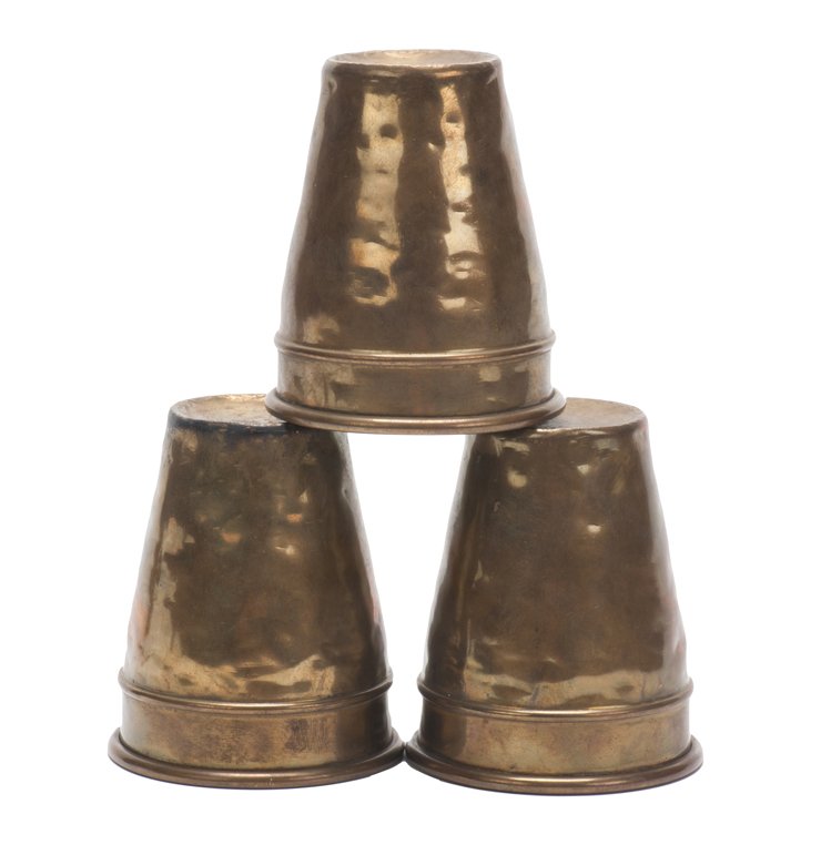 19th c. Brass Cups and Balls.: Brass Cups and Balls. European, ca. 1890. Large set of three spun brass cups for the perennial magic feat. Well worn from professional use, but with an attractive patina. 4 ¼” high. Mouth 3 ½” i