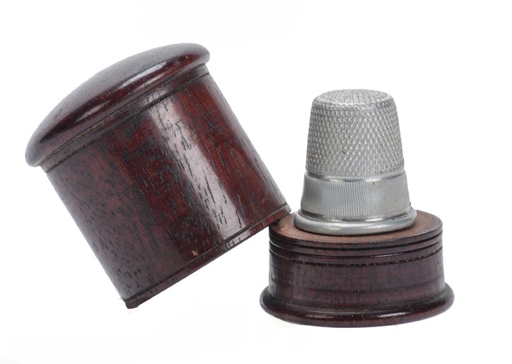 Thayer Thimblewiz.: Thimblewiz. Los Angeles, F.G. Thayer, ca. 1920. A thimble vanishes from and appears on a small turned mahogany stand when covered with a turned wooden lid. Overall height 1 5/8”. Likely turned by Fl