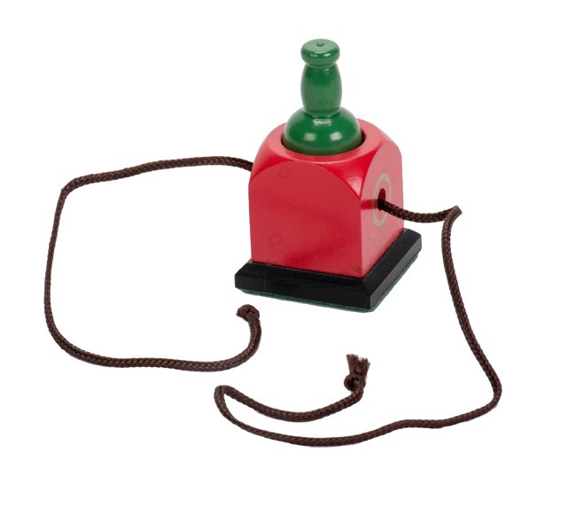 Bottle Penetration trick. Eddy Taytelbaum,: Bottle Penetration trick. Holland, Eddy Taytelbaum, ca. 1970. A small wooden bottle is placed in a holder, and a cord is threaded through holes in both objects. The bottle then magically penetrates th