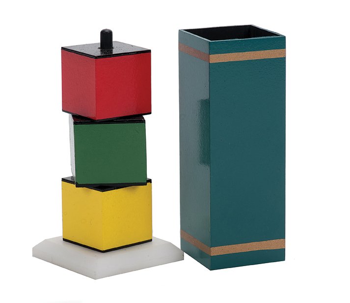 Traveling Block. Eddy Taytelbaum.: Traveling Block. Holland, Eddy Taytelbaum, ca. 1970. A small yellow block vanishes from between two others when covered with a tube, and reappears elsewhere. Height of tube 3”. Fine.