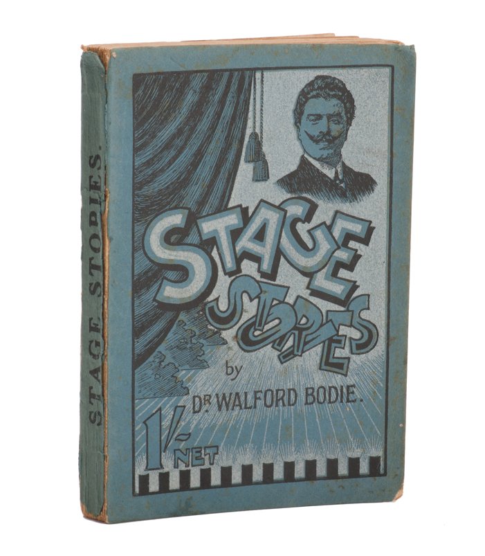 Bodie, Dr. Walford. Stage Stories.: Bodie, Dr. Walford. Stage Stories. London: Simpkin, Marshall, Hamilton, Kent & Co., ca. 1906. Blue pictorial wraps. Illustrated. 8vo. Spine chipped and wraps loose, binding tight; good, especially for
