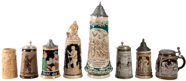 Group of Seven German Steins and One Pitcher. Includes thre...