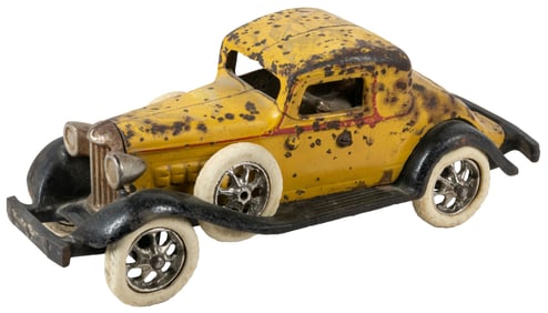 Arcade REO Cast Iron Royal Coupe. Yellow and black paint, r...