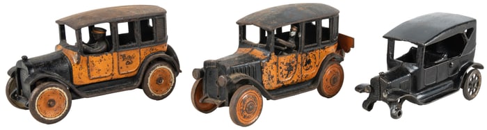 Pair of Cast Iron Taxi Cabs. Two black and orange town car ...