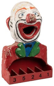 Carnival Clown Ball Toss Game. Circa mid-20th century. Papi...