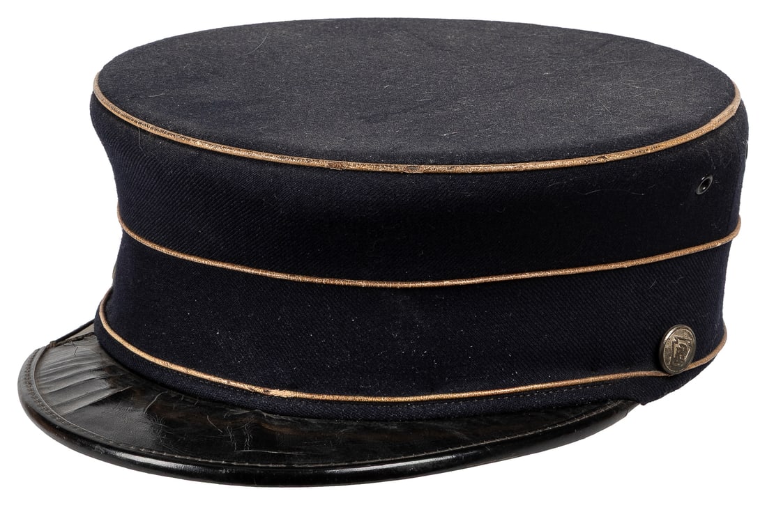 ECK, Johnny (Johnny Eckhardt, 1911 – 1991). Johnny Eck’s tr...: ECK, Johnny (Johnny Eckhardt, 1911 – 1991). Johnny Eck’s train conductor hat, photos, and ephemera. Includes: a wool and leather PRR conductor cap (few cracks and snapped area on bill); a