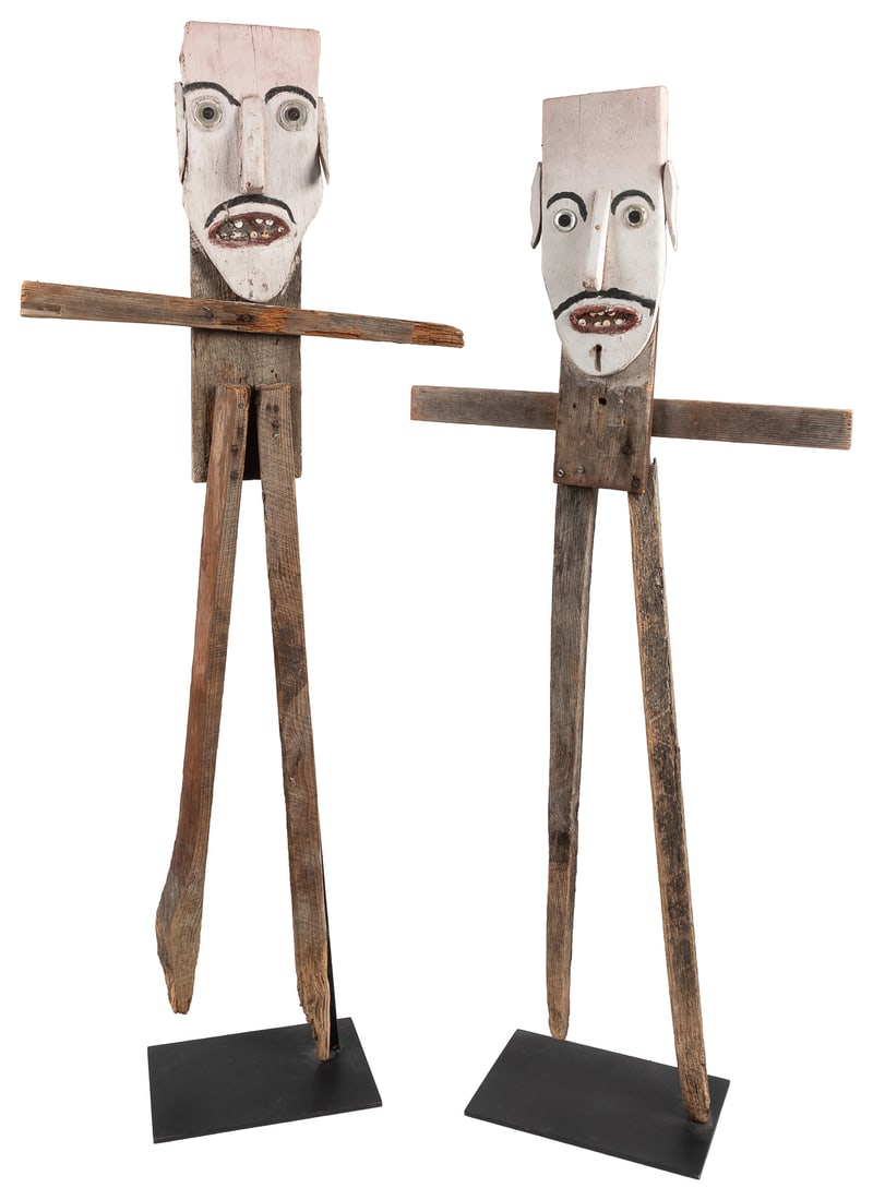 Pair of Folk Art Scarecrows. (American, 20th century). Not ...: Pair of Folk Art Scarecrows. (American, 20th century). Not dated. Mixed media on constructed wood. Largest with custom metal base. 54 h x 22 w x 8” d. This pair of scarecrows were surely enhance