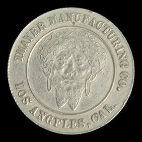 THAYER, Floyd (1877 – 1959). Thayer Manufacturing Co. Token...