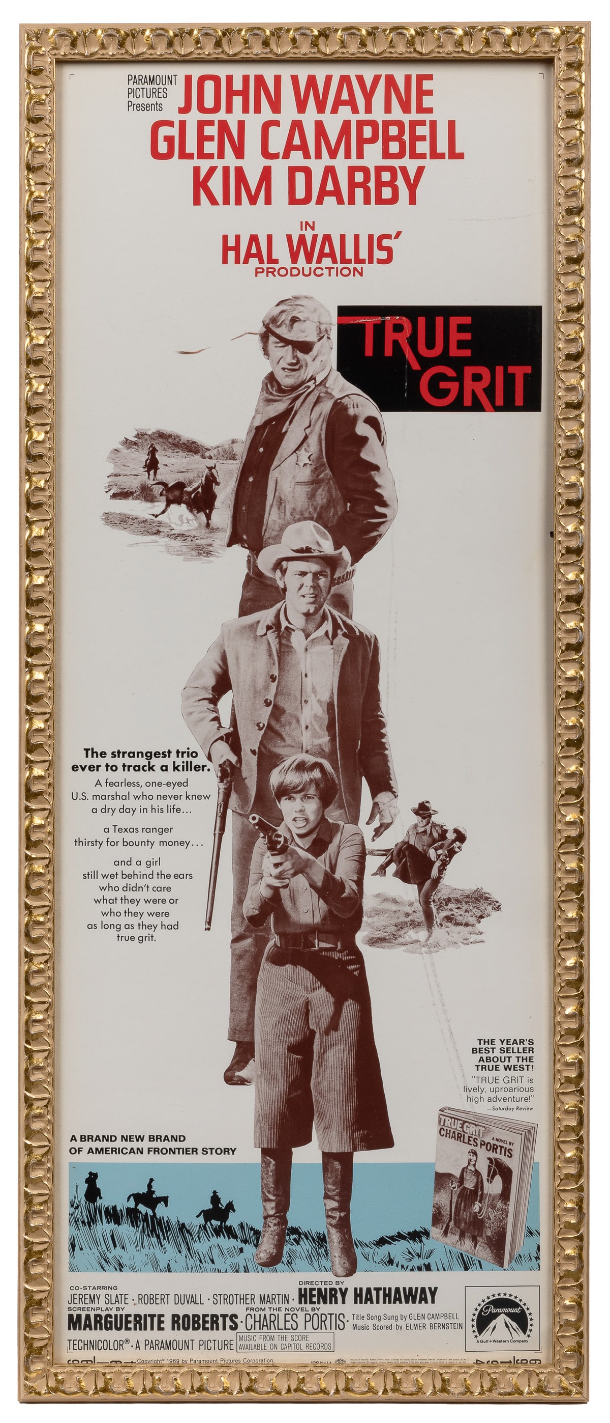 True Grit. Paramount, 1969. Insert (36 x 14”). Poster for t...: True Grit. Paramount, 1969. Insert (36 x 14”). Poster for the Western with John Wayne, Glen Campbell, Kim Darby, Jeremy Slate, Robert Duvall, and Dennis Hopper. Framed.
