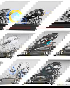 Group of 6 Signed NFL Mini Helmets. Six autographed mini he...: Group of 6 Signed NFL Mini Helmets. Six autographed mini helmets in display cases, several mirrored or etched with the team logo. Includes (authenticator noted in parentheses): Lamar Jackson (JSA), Ja