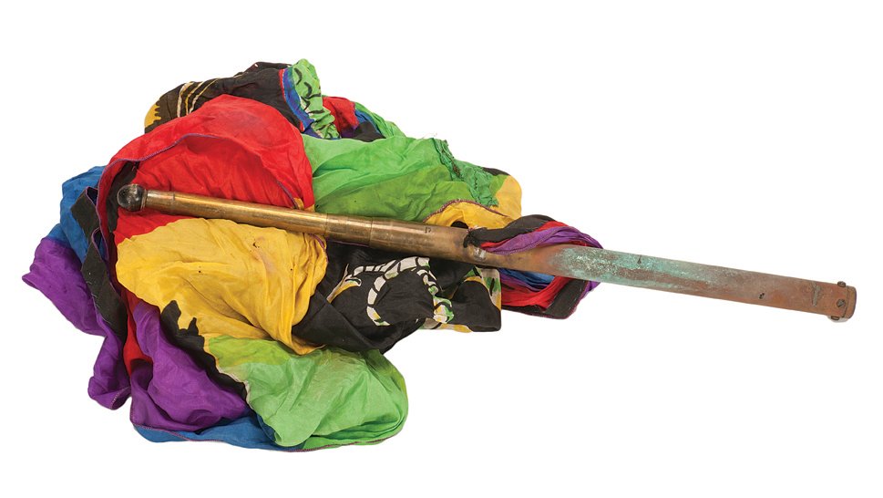 Cardini’s Flag Staff production.: Cardini’s Flag Staff production. British, ca. 1920. Collapsible brass flagstaff with brightly colored Tannen-brand silk handkerchief attached. 12” long when collapsed. Handkerchief tattered, some