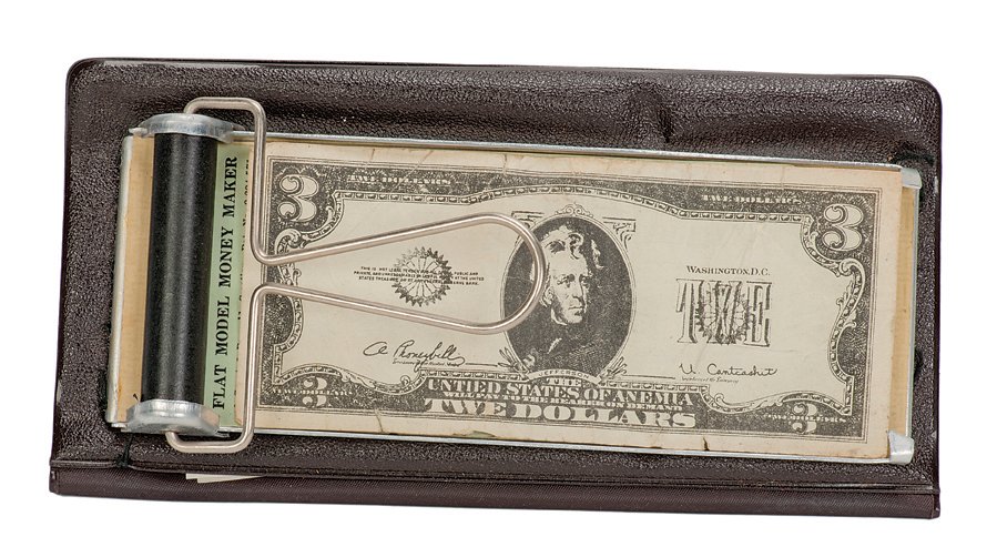 Cardini’s Flat-Model Money Maker.: Cardini’s Flat-Model Money Maker. Columbus, U.F. Grant, ca. 1960. A blank sheet of paper set on the bed of this device visibly changes to a real bill when a roller is passed over it. With a stack of