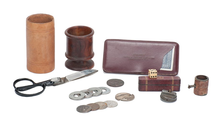 Collection of magic props owned and used by Cardini: [Props] Collection of miscellaneous magic props owned and used by Cardini. Including a vanishing glass of milk with gimmicked leather tube, no-cut scissors, joy buzzer, turned wooden cup, several gimm