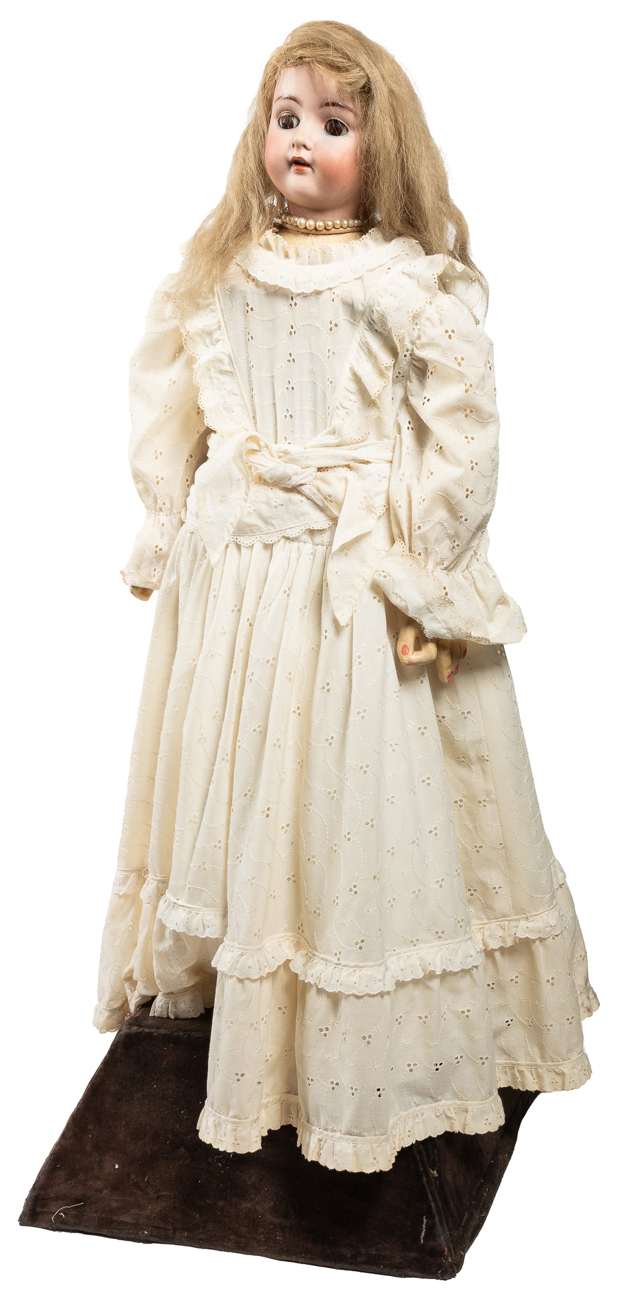 Automaton Doll. Circa late 19th/early 20th century. Electro...: Automaton Doll. Circa late 19th/early 20th century. Electro-mechanical doll automaton depicting a standing figure in cream lace dress, bisque head marked Made in Germany with “AB” maker