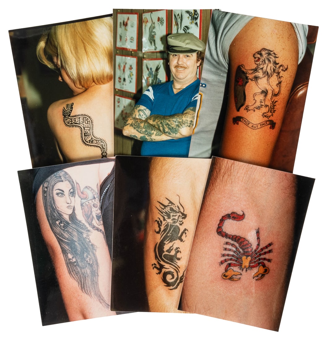 [TATTOOS]. Archive of tattoo photographs. Circa 1990s-2000s...: [TATTOOS]. Archive of tattoo photographs. Circa 1990s-2000s. 40 black cloth photo albums, each holding approximately 30 color photographs (6 x 4”) of tattoos on men and women. Albums labeled by 