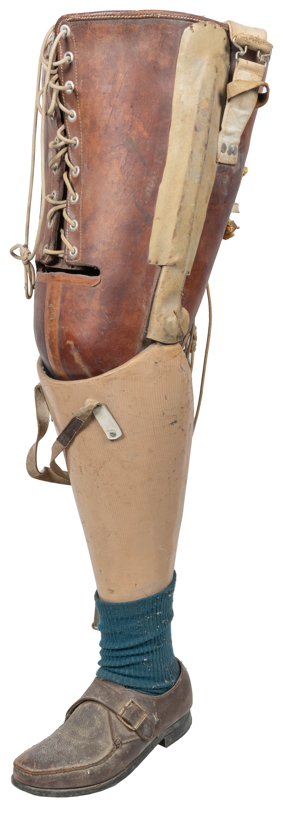 Medical Leg Prosthesis with Cloth and Leather Thigh Harness...: Medical Leg Prosthesis with Cloth and Leather Thigh Harnesses, and Cord Stabilization Assembly on Rear. 20th century. Wooden leg prosthesis with shoe and sock, leather lace-up harness, metal hinges at