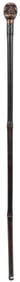 Carved Skull Sword Cane. Carved and polished wooden skull h...