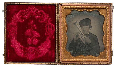 [EARLY PHOTOGRAPHY]. Sixth plate ambrotype of a musician wi...