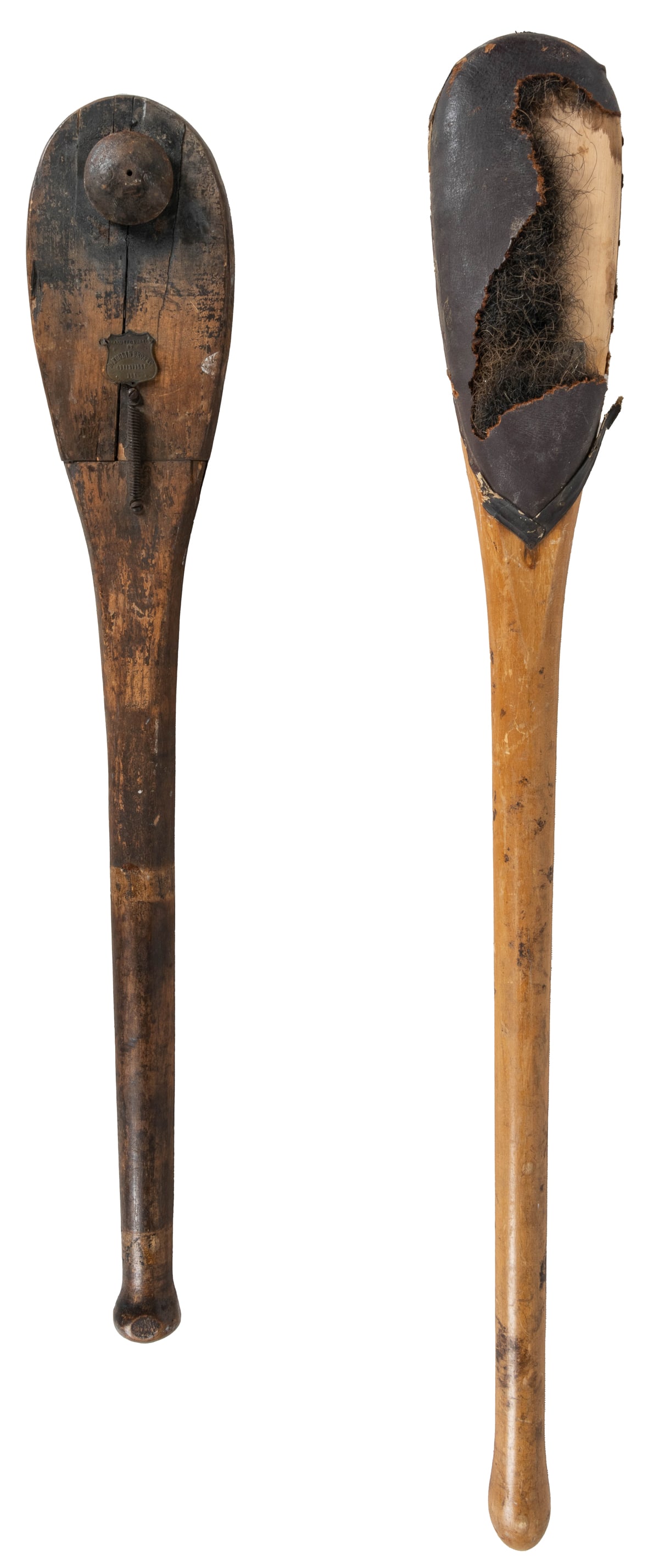 Spanker Paddles. (Two). De Moulin (Medallion) and Cincinnat...: Spanker Paddles. (Two). De Moulin (Medallion) and Cincinnati Regalia Company (Medallion). 20th century. Wood, leather, metal hardware. Fraternal order initiation device. Spanking paddle to strike on t