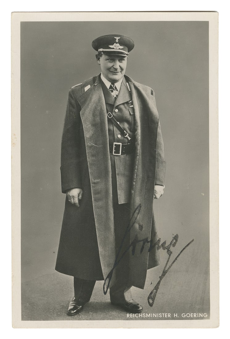 GOERING, Hermann (1893-1946). Signed Real Photo Postcard. [...: GOERING, Hermann (1893-1946). Signed Real Photo Postcard. [Munich: Hoffman, ca. 1940]. Black and white photo of the full figure of Goering in his “Reichminister” (Luftwaffe) uniform, signe