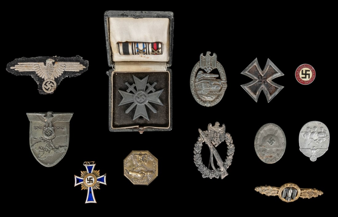 Group of German World War II era military pins and ephemera... (1 of 2)