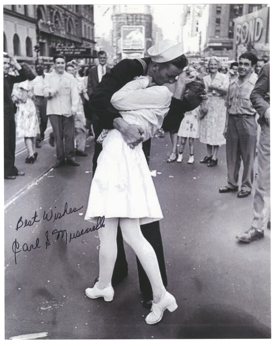 [V-J DAY – WORLD WAR II]. Times Square V-J Day Kiss signed ...: [V-J DAY – WORLD WAR II]. Times Square V-J Day Kiss signed photograph. A modern printing of the iconic image by Alfred Eisenstaedt, signed by sailor Carl Muscarello: “Best wishes/Carl Musc