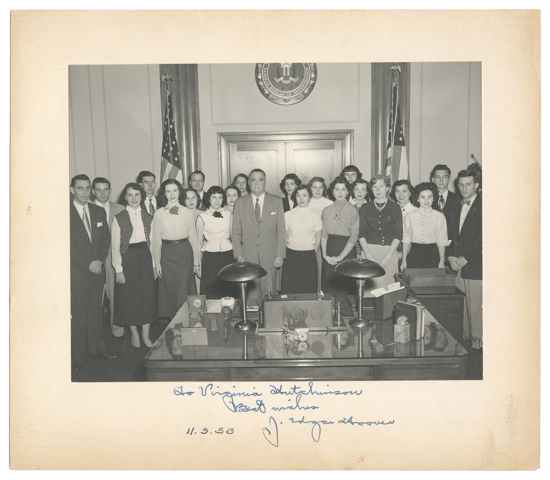 J. Edgar Hoover inscribed photograph. [1953]. Matte-finish ...: J. Edgar Hoover inscribed photograph. [1953]. Matte-finish silver gelatin photograph, on cardstock mount, depicting Hoover with the FBI Recreation Association Camp Show Troupe, whose members are