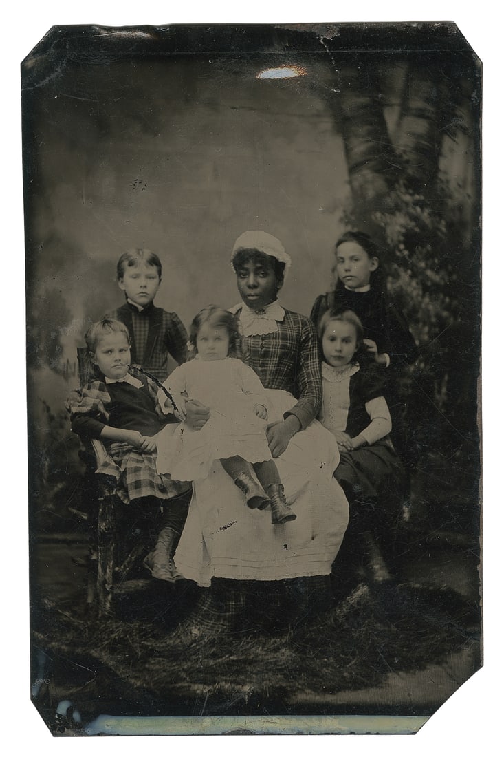 [EARLY PHOTOGRAPHY]. Tintype of an African American maid an... (1 of 2)