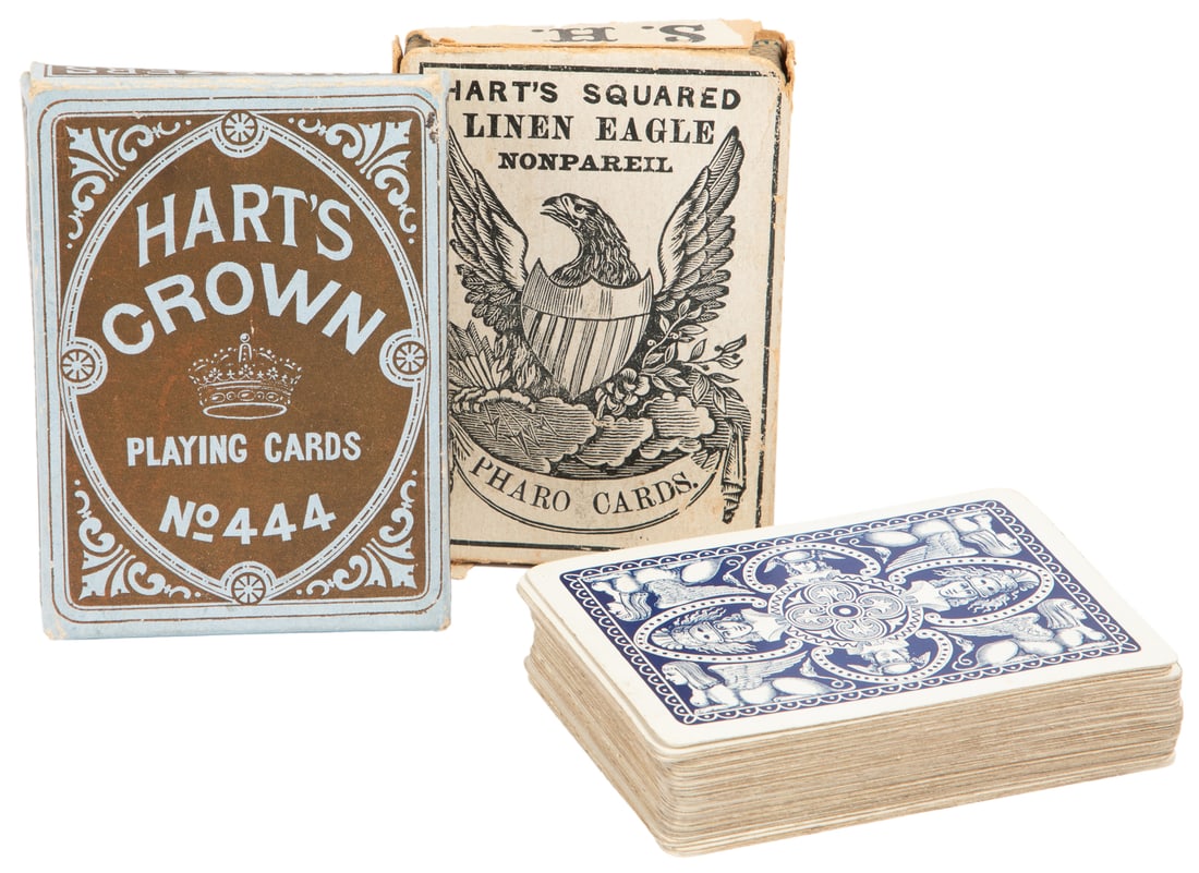 Samuel Hart & Co. / NYCC playing cards. Three decks. Includ...: Samuel Hart & Co. / NYCC playing cards. Three decks. Including Hart’s Squared Linen Eagle Nonpareil Pharo Cards. New York, ca. 1880s. Box depicts an eagle with a flagged shield, clinging to arro