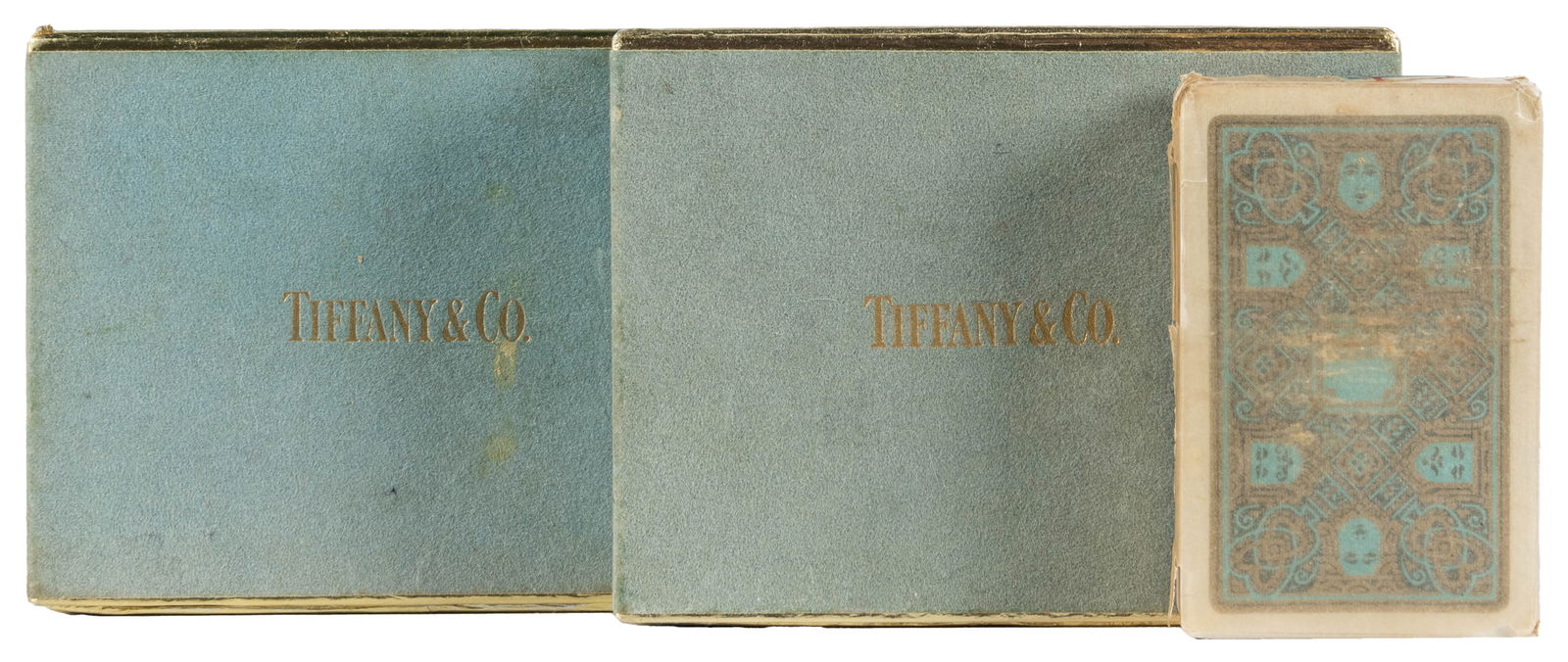 [TIFFANY & CO.]. Pair of Double-Deck Playing Card Sets, and...: [TIFFANY & CO.]. Pair of Double-Deck Playing Card Sets, and two others. New York, ca. 1950s. Includes two double-deck sets in original boxes, one set with monogrammed “KC” backs, the other