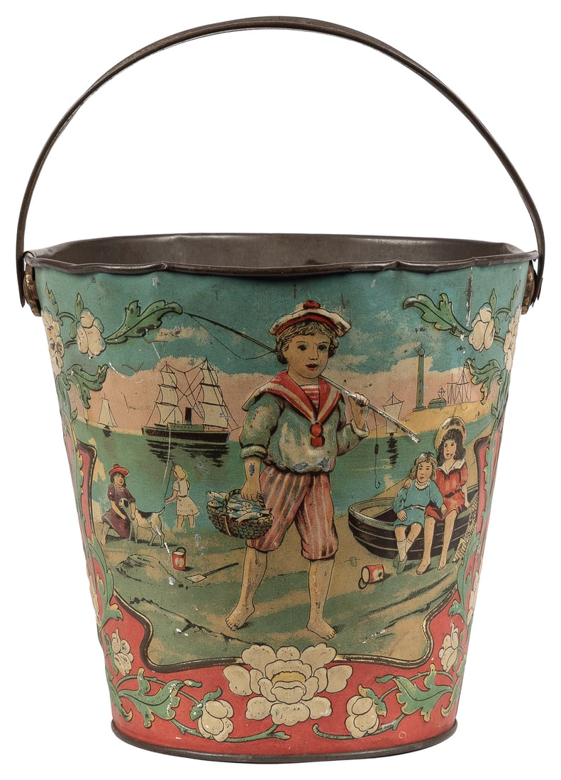 Antique German Embossed Tin Litho Sand Pail Toy. Circa 1880...: Antique German Embossed Tin Litho Sand Pail Toy. Circa 1880s. Stamped DRGM underside with horse logo. Embossed sides with a vignette of a boy fisherman on one side, and a couple walking along the