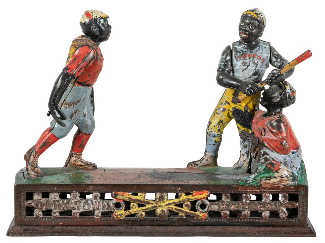 J & E Stevens Darktown Battery Cast Iron Mechanical Bank. J...: J & E Stevens Darktown Battery Cast Iron Mechanical Bank. J & E Stevens, ca. 1880s. Depicting three Black baseball players (pitcher, batter, and catcher), lettered Dark Town Battery across the front