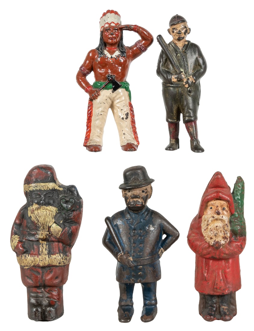Group of 4 cast iron figural still banks, and a doorstop. C...: Group of 4 cast iron figural still banks, and a doorstop. Circa 1900s. Includes: baseball player, Santa Claus, Native American, and “Mulligan” policeman still banks; and Santa Claus door