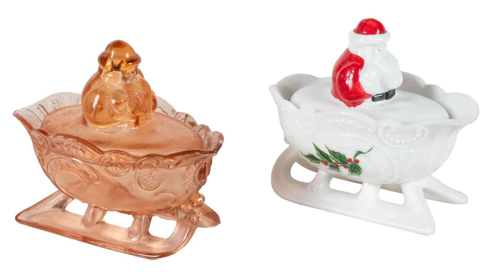 Pair of Westmoreland Santa on Sleigh Covered Dishes. Includ...: Pair of Westmoreland Santa on Sleigh Covered Dishes. Includes one milk glass example, and a pink glass example. Length 5 ½”.