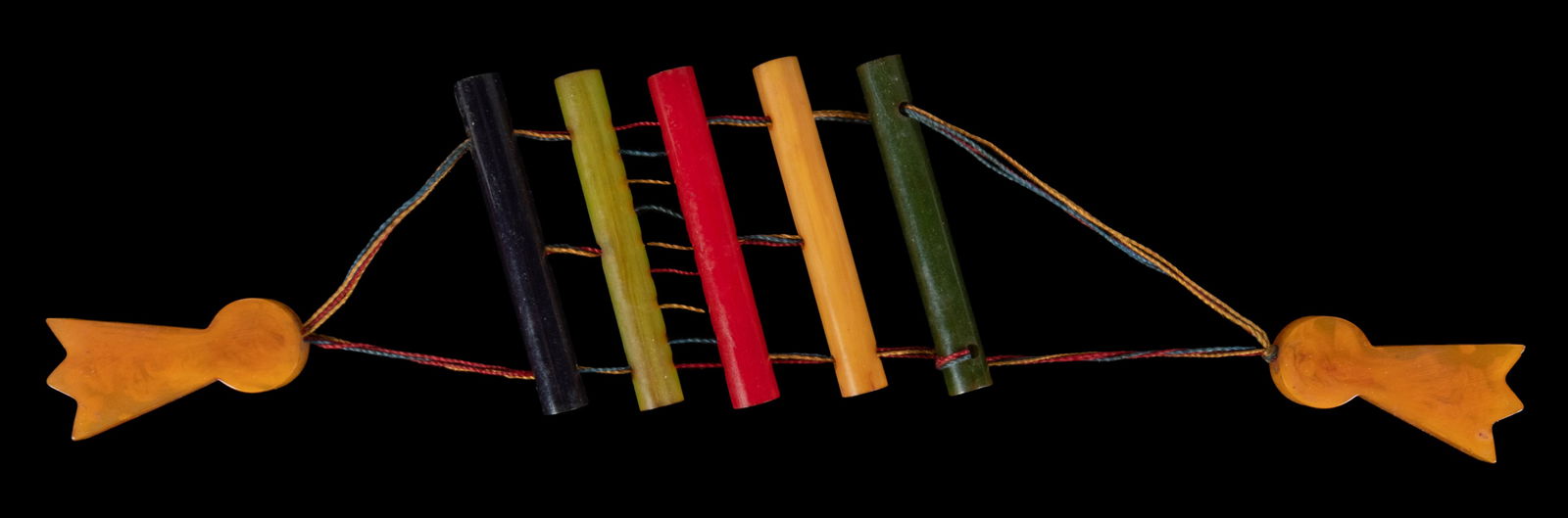 Bakelite String Puzzle Optical Illusion. 20th century. Bake...: Bakelite String Puzzle Optical Illusion. 20th century. Bakelite and string optical illusion in which a string appears to multiply as it passes between different rungs. Length 13”. Very good.