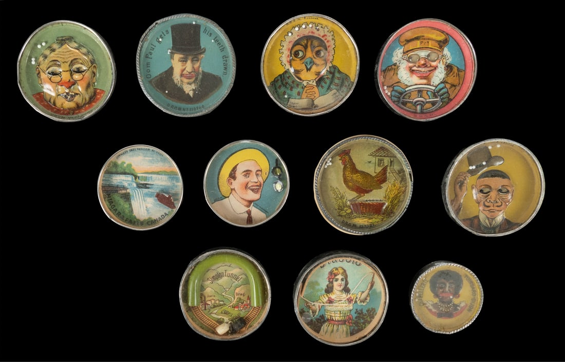 Group of 11 German Dexterity Puzzles. Germany: DRGM, ca. ea...: Group of 11 German Dexterity Puzzles. Germany: DRGM, ca. early 20th century. Group of 11 dexterity puzzle pocket mirrors (mirrors verso). Six are embossed. Several with objectives such as putting glas