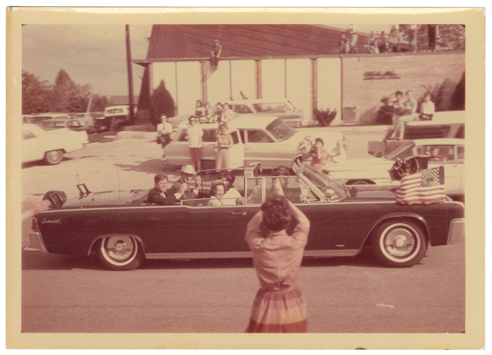 San Antonio Motorcade / Day Before JFK Assassination. 1963. : San Antonio Motorcade / Day Before JFK Assassination. 1963. Color photograph/snapshot on Kodak paper ("A Kodak paper" watermark verso) showing John F. Kennedy, First Lady Jaqueline Kennedy, Texas Gov.